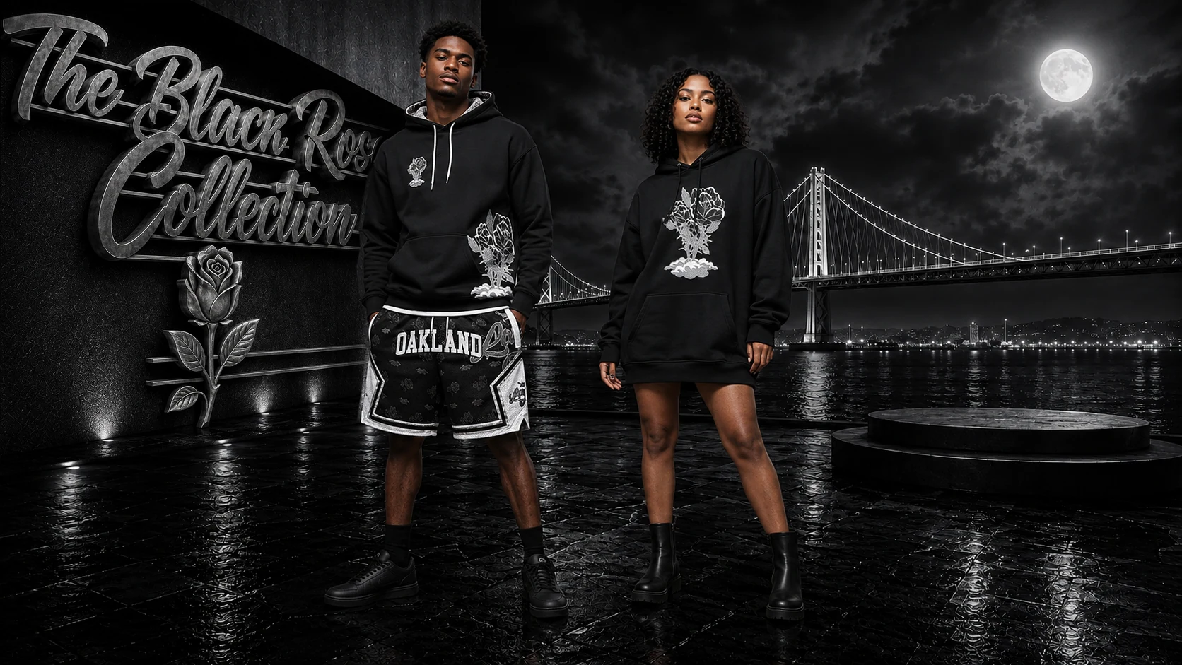 Two models on the moonlit Bay Bridge terrace: one wears the BLACK Rose Hoodie — Signature Edition with BLACK Rose x Love Hurts Basketball Shorts, and the other wears the BLACK Rose Hoodie as a longline look.